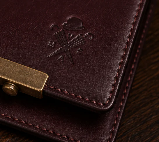 Close view of the bridle leather, saddle stitching and brass hardware